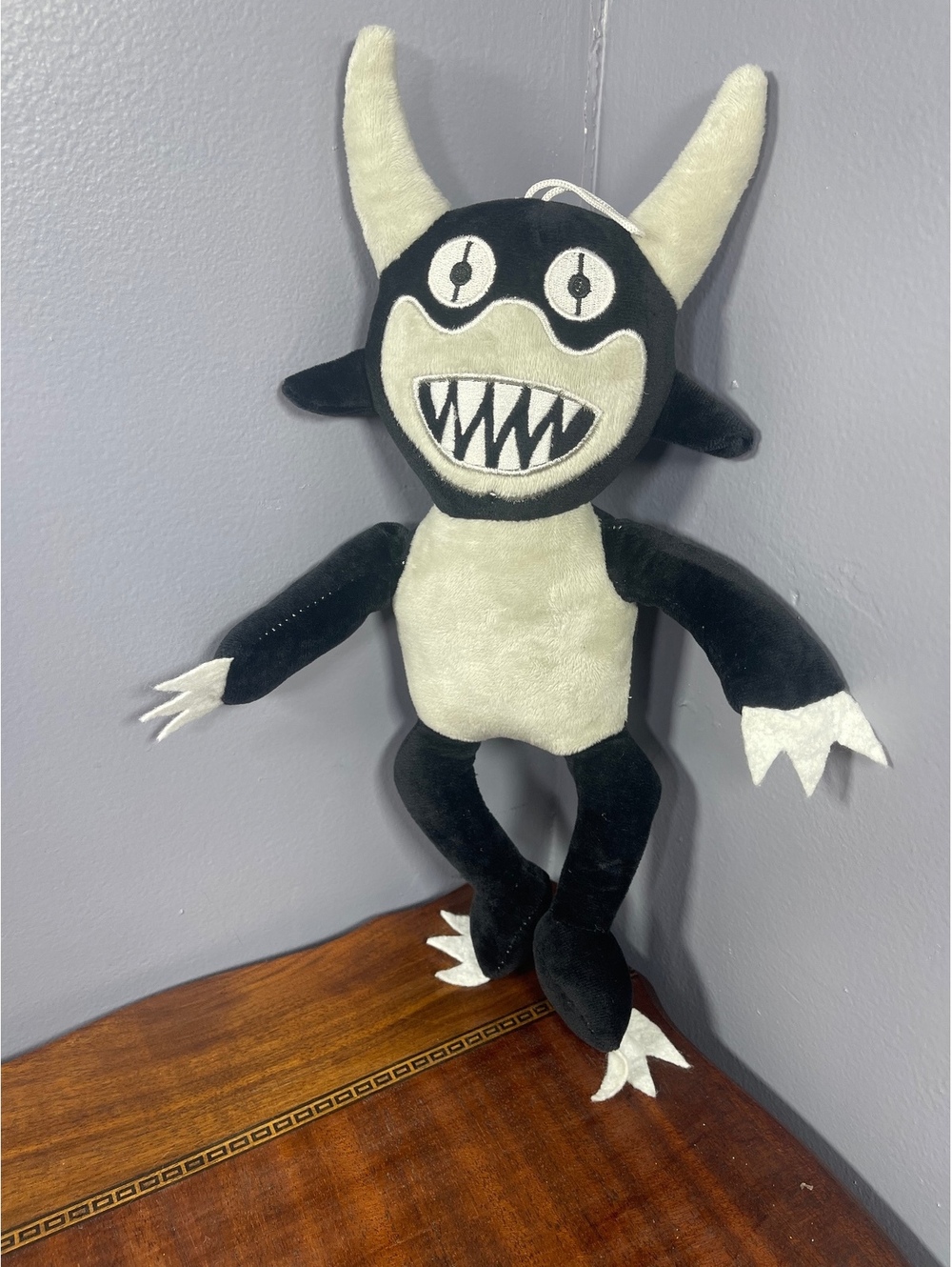 Black and White Plush Monster Doll with Horns and Claws